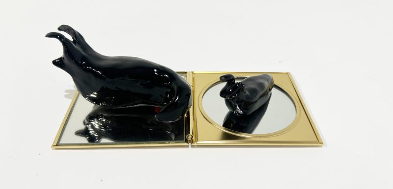 Tai Snaith 'Flotilla (there’s no dignity in haste) 25' 2025 glazed black midfire ceramic and vintage mirror 15 x 7 x 4.5 cm $220