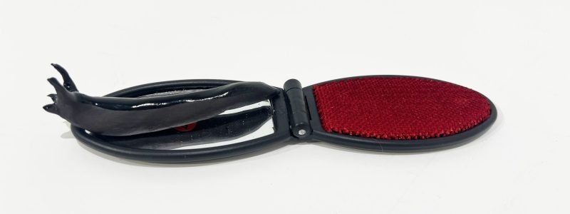 Tai Snaith 'Flotilla (there’s no dignity in haste) 29' 2025 glazed black midfire ceramic and vintage mirror 18 x 5 x 3 cm $190