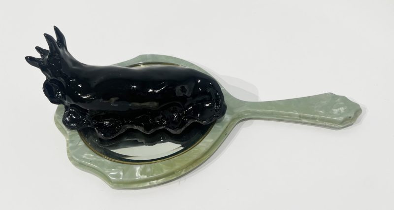 Tai Snaith 'Flotilla (there’s no dignity in haste) 7' 2025 glazed black midfire ceramic and vintage mirror 26 x 15 x 9 cm $770